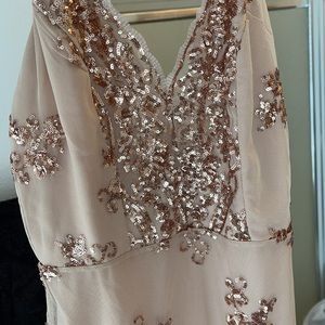 Gold sequins dress. Super cute! Never worn. Size says xl but if more of a medium
